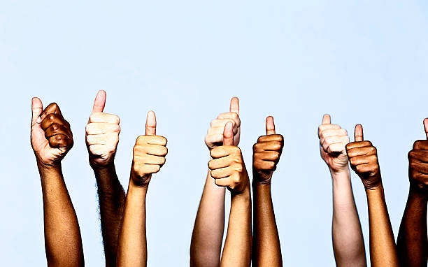 istock Nine mixed hands give approving thumbs-up signals 480953387