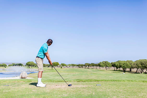 istock African golfer ready to hit the golf ball 480954075