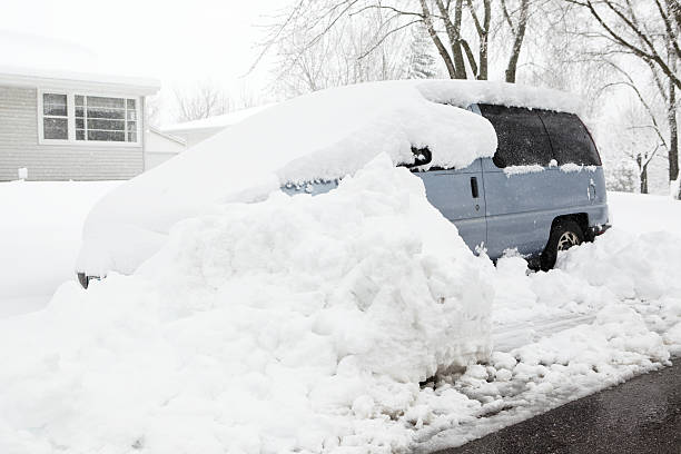 istock Winter Snowstorm with Buried Minivan at Roadside 480954565