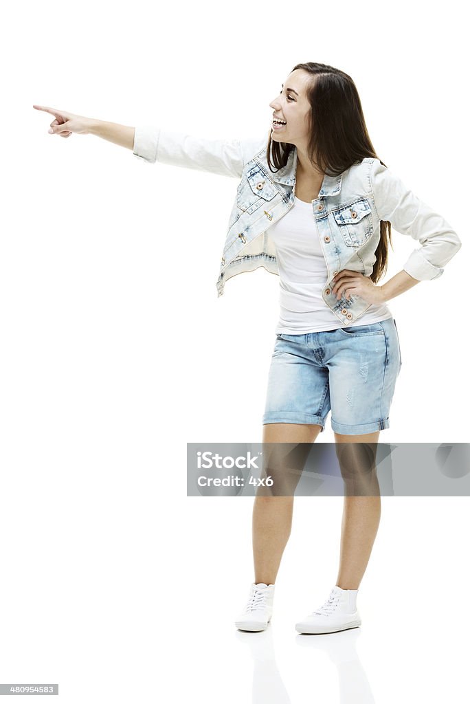 Attractive young woman pointing Attractive young woman pointinghttp://www.twodozendesign.info/i/1.png 20-29 Years Stock Photo