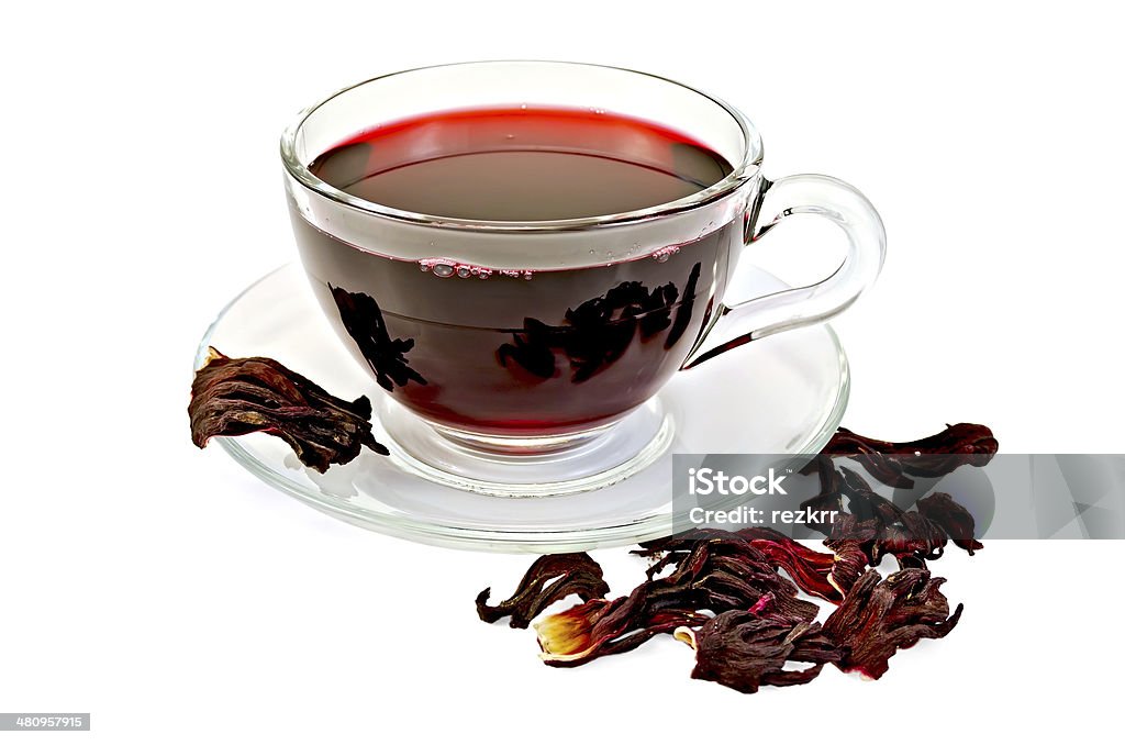 Tea hibiscus with petals Hibiscus tea in a glass cup, dry petals tea isolated on white background Alternative Therapy Stock Photo