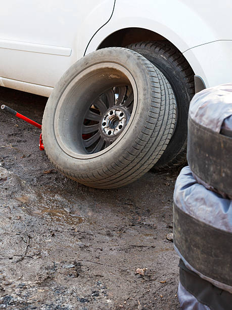 istock replacement of car tyres - tire fitting 480959605