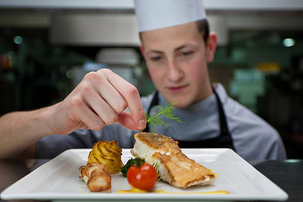 cook serving a meal cook serving a meal sideboard photos stock pictures, royalty-free photos & images