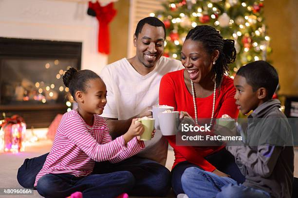Family Gathered On Christmas Morning Stock Photo - Download Image Now - Family, Christmas, Drinking