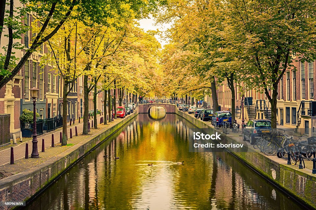 Canal in Amsterdam Bridge over canal in Amsterdam 2015 Stock Photo