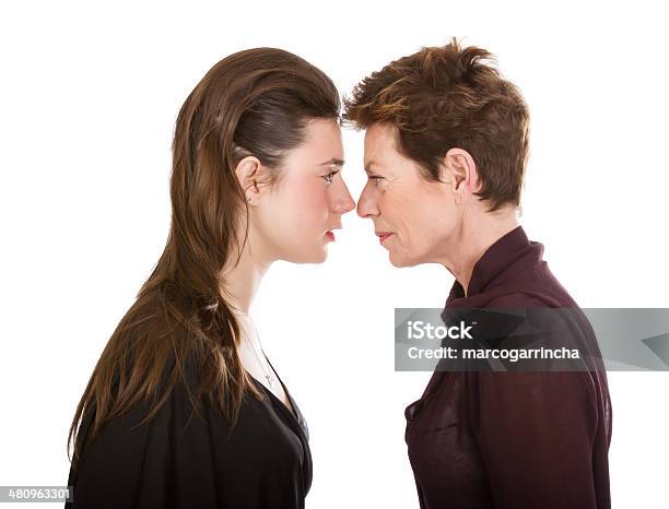 Generational Difference Metaphor Stock Photo - Download Image Now - Profile View, Anger, Human Face