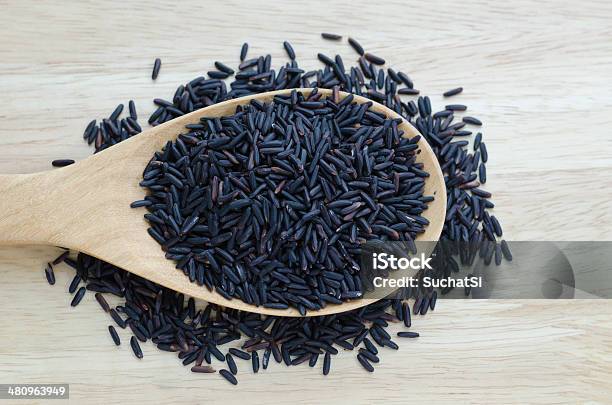 Rice Berry In A Wooden Ladle On Wood Table Stock Photo - Download Image Now - Agriculture, Backgrounds, Brown