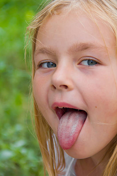 istock Cute girl with put out tongue 480964220