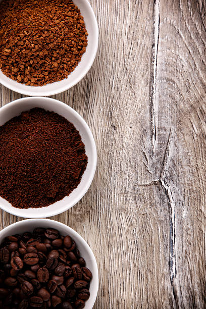 istock Coffee beans, ground coffee and instant coffee in three bowls 480965007