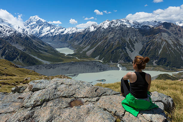 istock Woman Traveler with Backpack hiking in Mountains 480965284