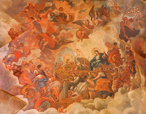 Granada, Spain - May 29, 2015: The ceiling fresco displays the Glory of lamb of God in Basilica San Juan de Dios by Diego Sanchez Sarabia from second part of 18. cent. 