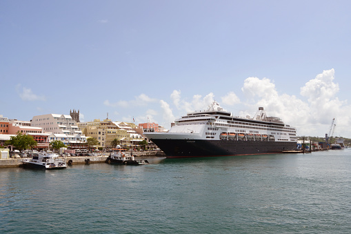Hamilton, Bermuda -- July 9, 2015:Looking at a Holland America Line cruise ship at dock in Hamilton, Bermuda.  Cruise ships travellers are a large part of the tourism economy in Bermuda.  