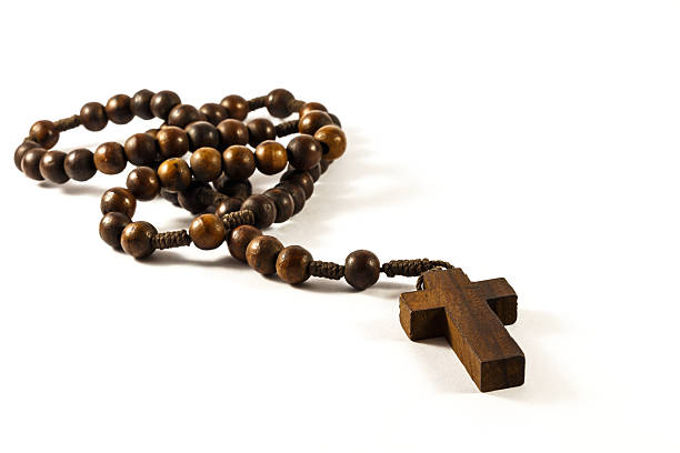 Wood rosary Wood rosary and cross with isolated background rood stock pictures, royalty-free photos & images