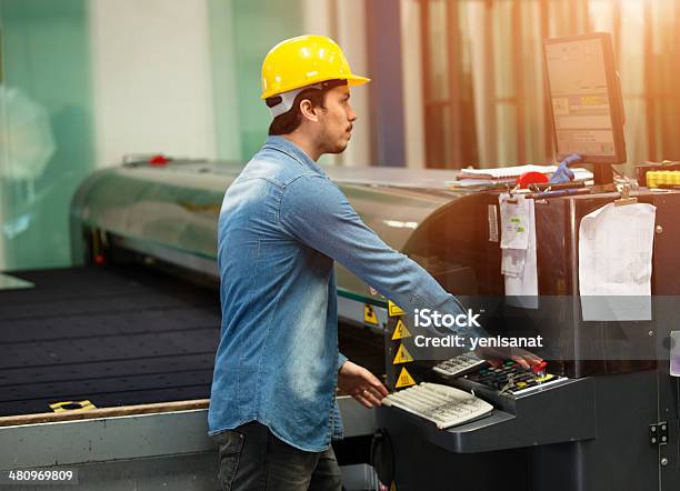Laborer Operator Machine Operator Working At Factory Stock Photo - Download Image Now ...