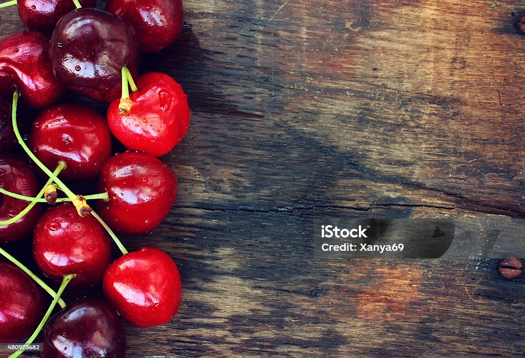 ripe sweet cherries ripe sweet cherries on old table 2015 Stock Photo