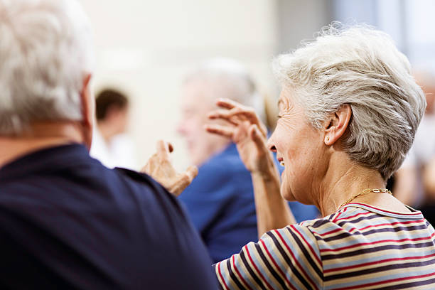 istock Seniors Enjoying Conversation In Community Center 480975653