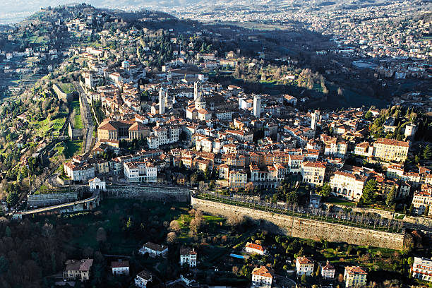 Bergamo, aerial view Citt? Alta - Flying over the city of Bergamo, North Italy bergamo stock pictures, royalty-free photos & images