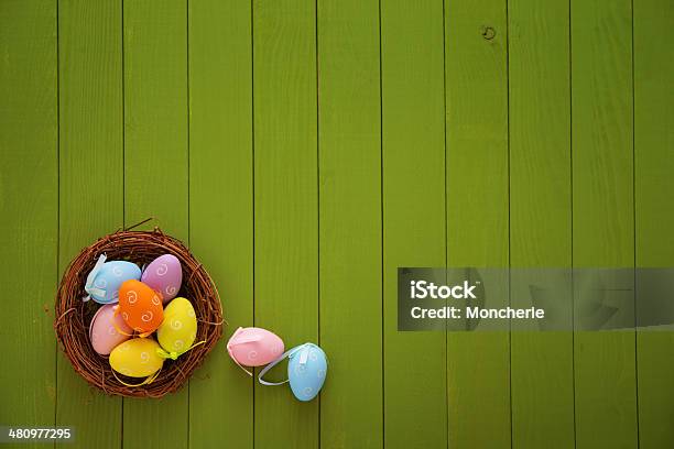 Colorful Easter Egg Nest On Softgreen Wooden Background Stock Photo - Download Image Now