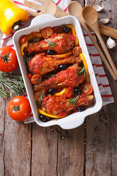 istock Chicken legs baked in tomato sauce vertical top view close-up 480980574