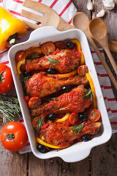 istock Chicken legs baked in tomato sauce vertical top view 480980576