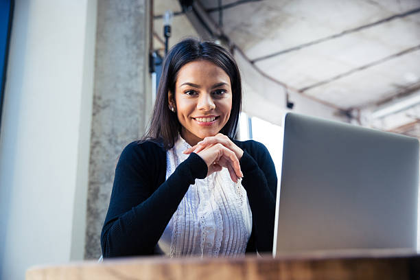 istock Smiling businesswoman in cafe 480981408