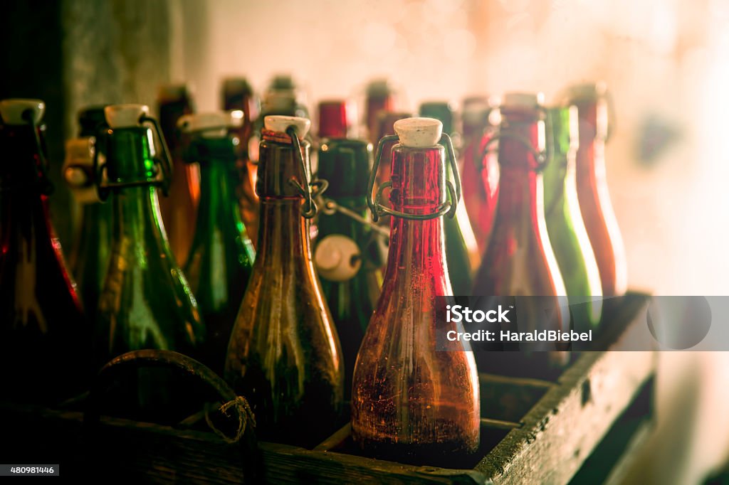 Old beer bottles in wooden cases Old beer bottles in wooden cases, shot taken with shallow DOF 2015 Stock Photo