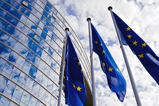 European Union Flags EU Flags at the European Commission Building european currency stock pictures, royalty-free photos & images