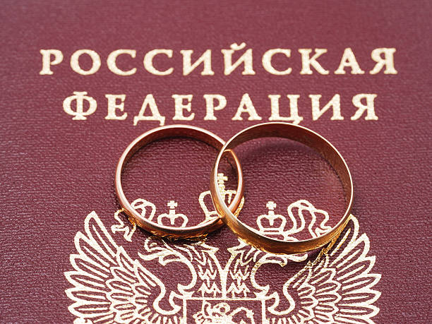 istock wedding rings and a Russian passport 480985438