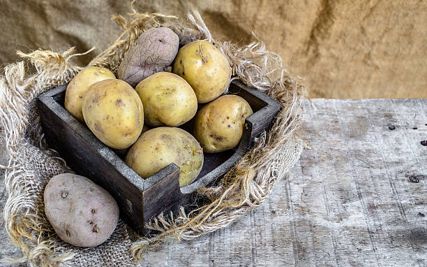 istock Organic potatoes on a wooden table 480986418