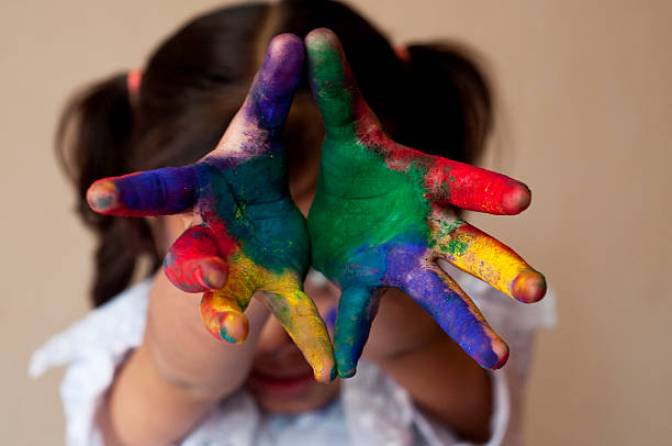 istock Girl showing colorful hands 480986793