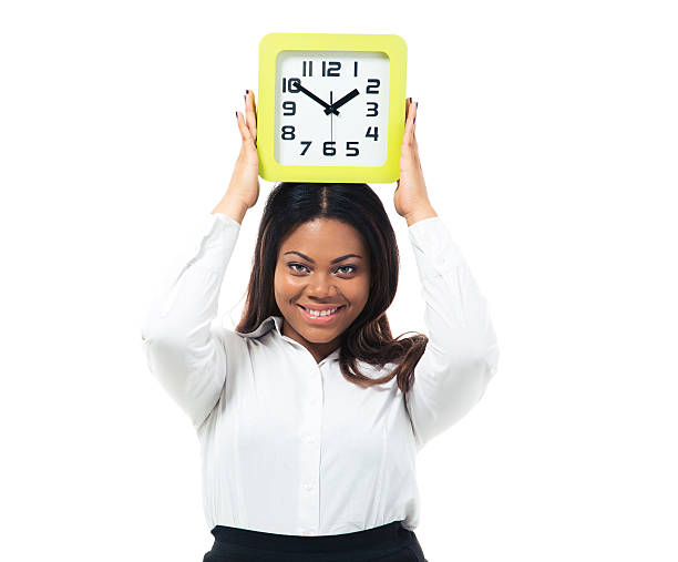 istock Businesswoman standing with clock on head 480990088