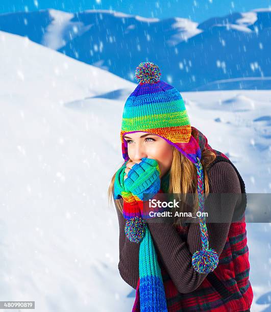 Female In Winter Mountains Stock Photo - Download Image Now - Adult, Blue, Cap - Hat