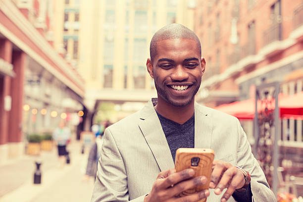 istock happy smiling urban professional man using smart phone 480990898