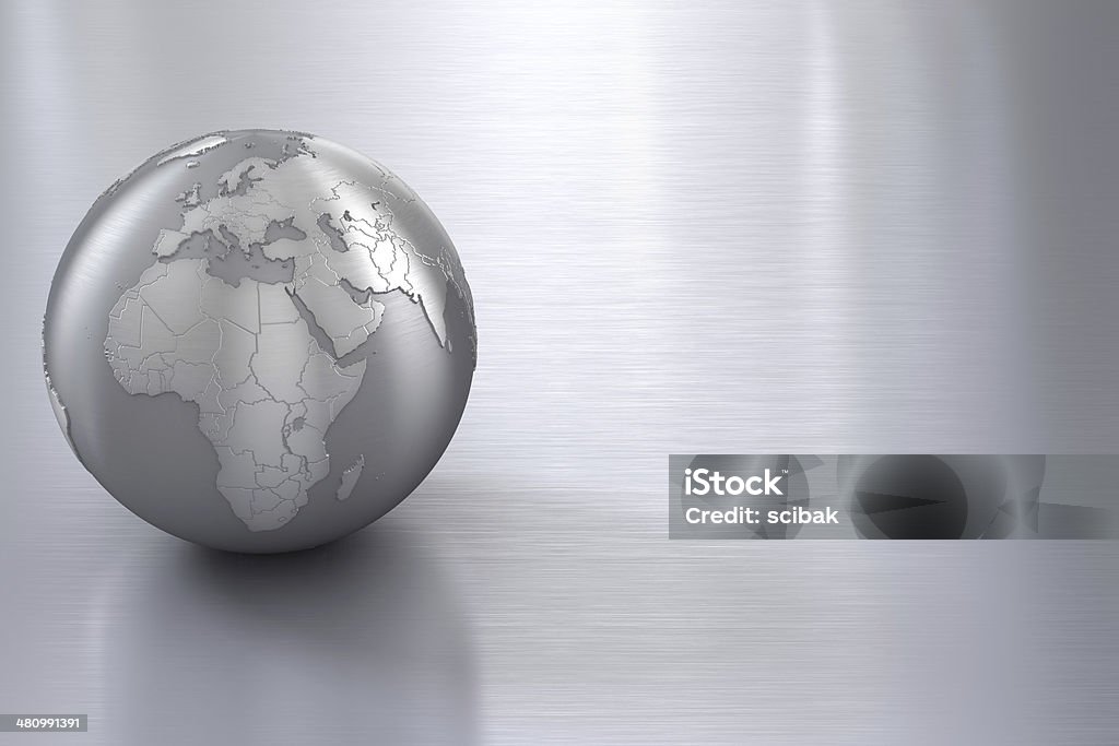 Silver globe on stainless steel with copy space Silver globe on brushed metal surface. Globe - Navigational Equipment Stock Photo