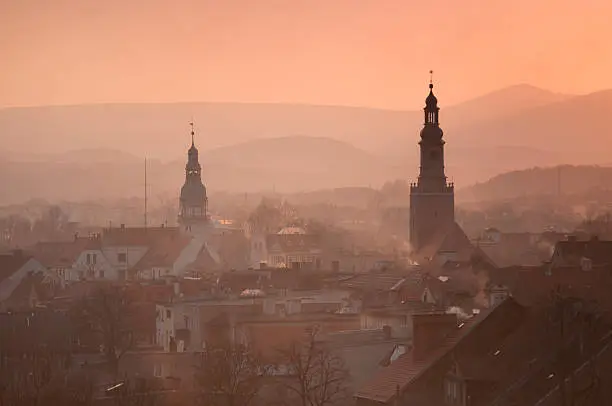 Church spire and the the town hall spire at dusk; Central Sudeten Mountains; the town of Kamienna Gora; south-western Poland