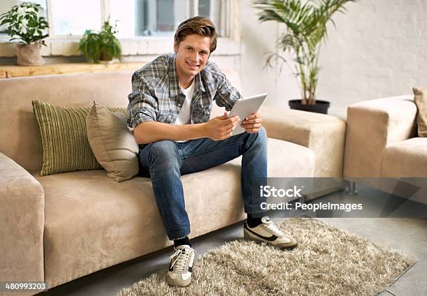 The Living Room His Happy Zone Stock Photo - Download Image Now - 20-24 Years, 20-29 Years, Adult