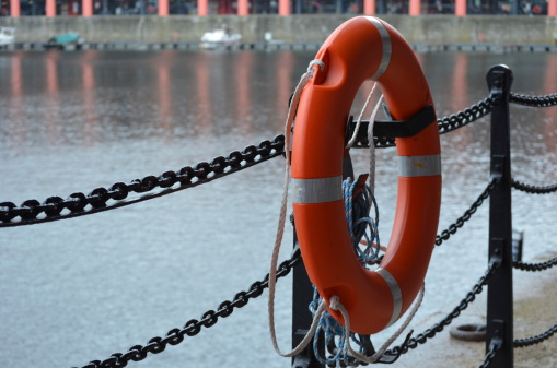 A life preserver (or ring) on a fence by the River Mersey water-front down in the dockland area of Liverpool.