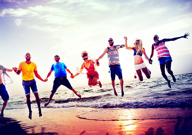 istock Diverse Beach Summer Friends Fun Jump Shot Concept 480995504