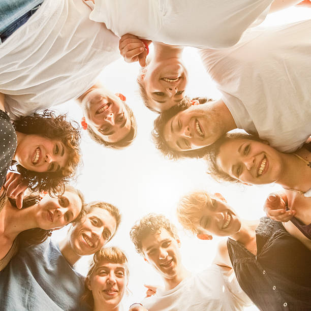 istock Group of friends at the park. View from below 480995644