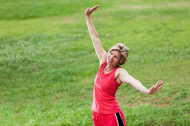 istock Woman exercising in park 480999297