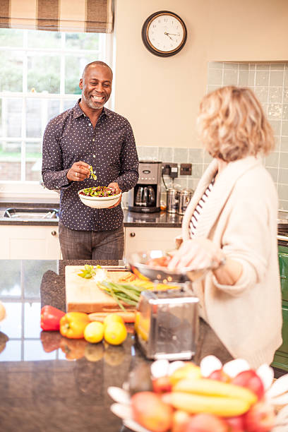 istock Preparing food in the kitchen, man laughing 480999709