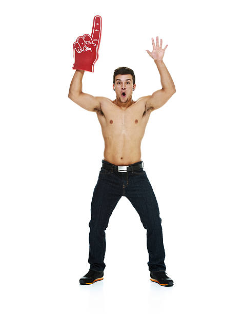 istock Cheerful young man standing with foam finger 481000739