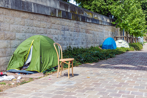 Tents of homeless people at riverside Seine in Paris