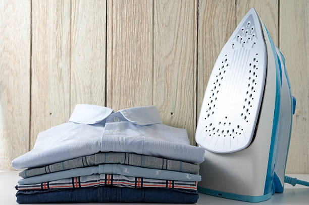 istock Clothes and iron with wood background 481002008
