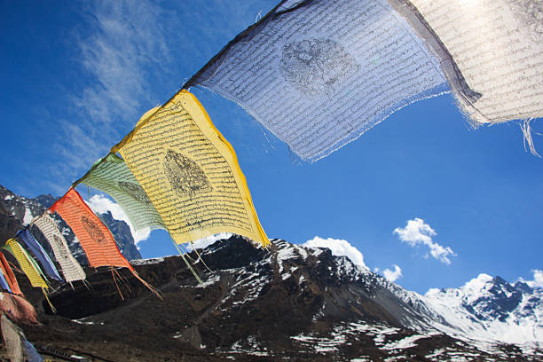 view of Everest with buddhist prayer flags from Nepal. stock photo