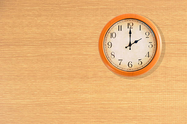 istock Clock showing 2 o'clock on a wooden wall 481005632