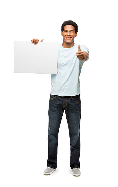 istock Latin man in casual clothes holding sign 481008211