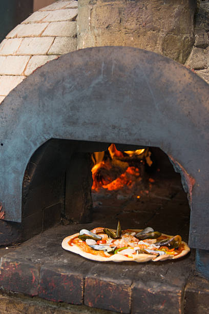 istock hot seafood pizza from old pizza oven 481009562