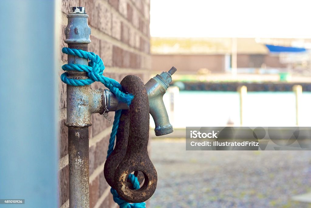 Tap outside Tap on a harbour with a rope. Shoot in Denmark by sunlight. 2015 Stock Photo