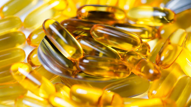 istock fish oil pills on tablespoon closeup 481011144